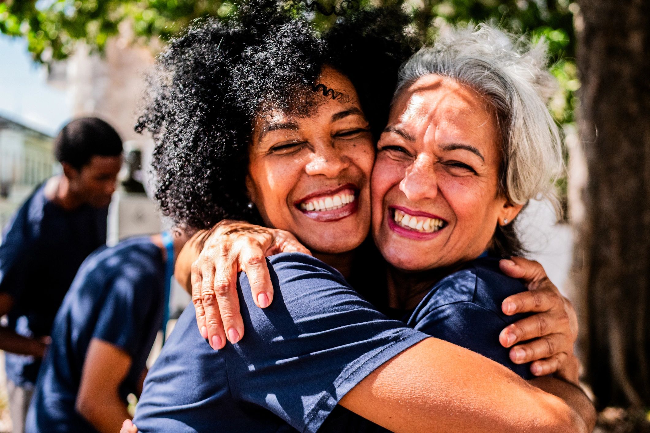 Volunteer friends embraced outdoors